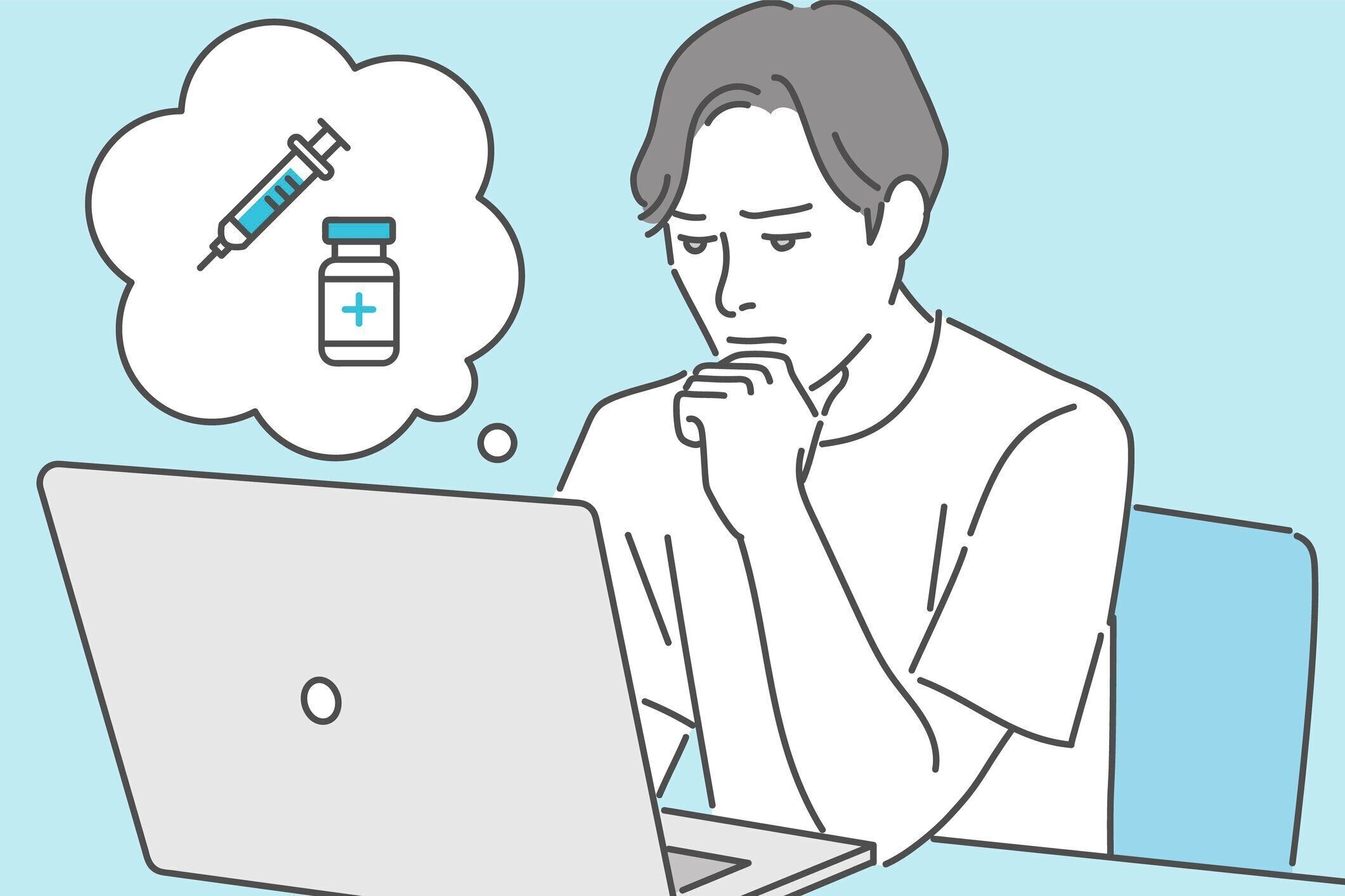 ラップトップを使ってワクチンに関する情報をインターネットで検索する男性。