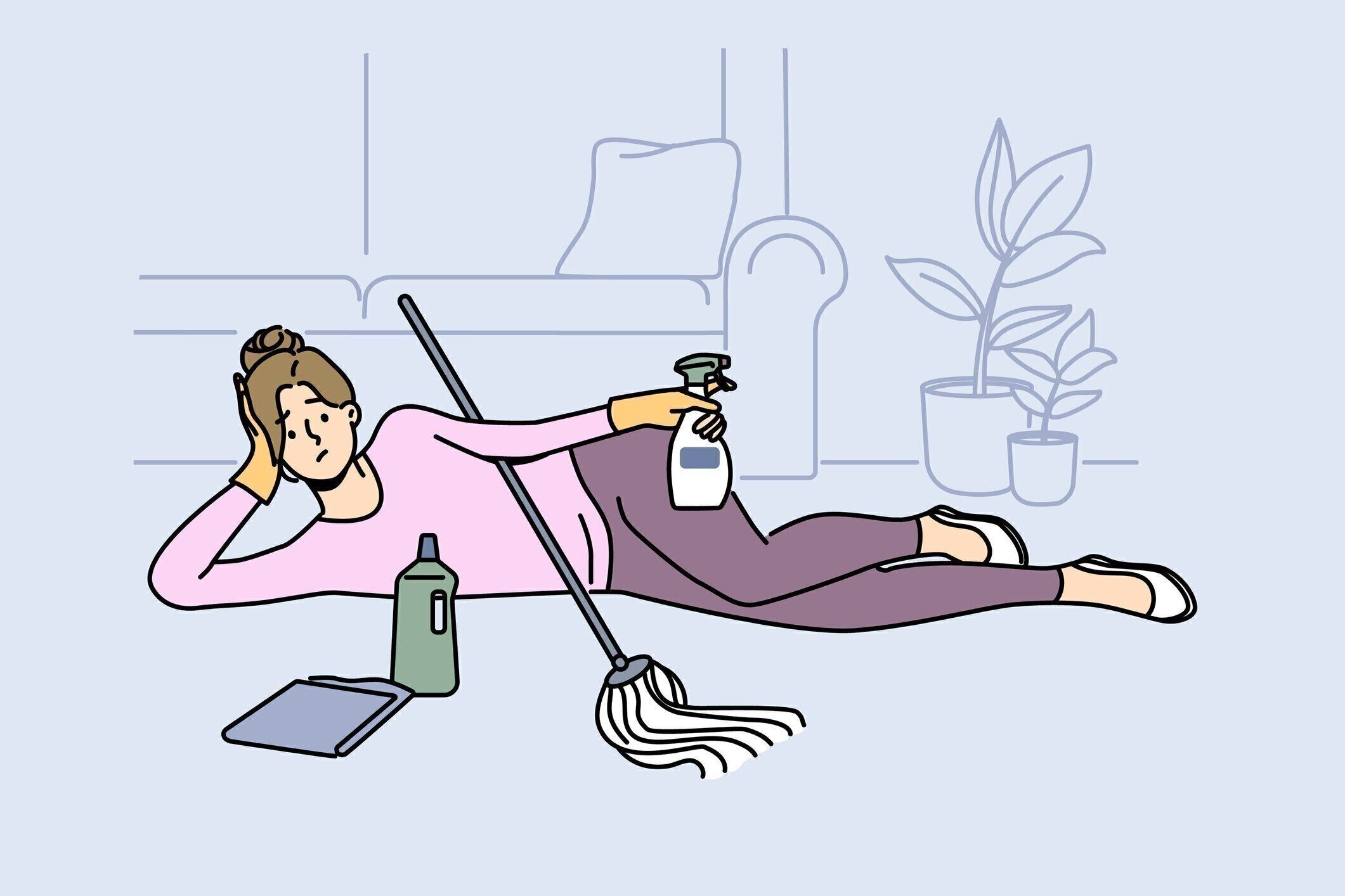 掃除中に床に横たわる疲れた怠惰な女性