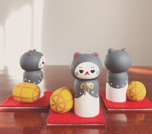 表情がかわいい猫こけし