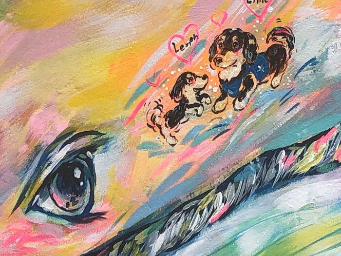 仲の良い2頭のダックスフンドをクジラが見つめています