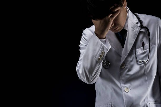 頭を持つ医師
