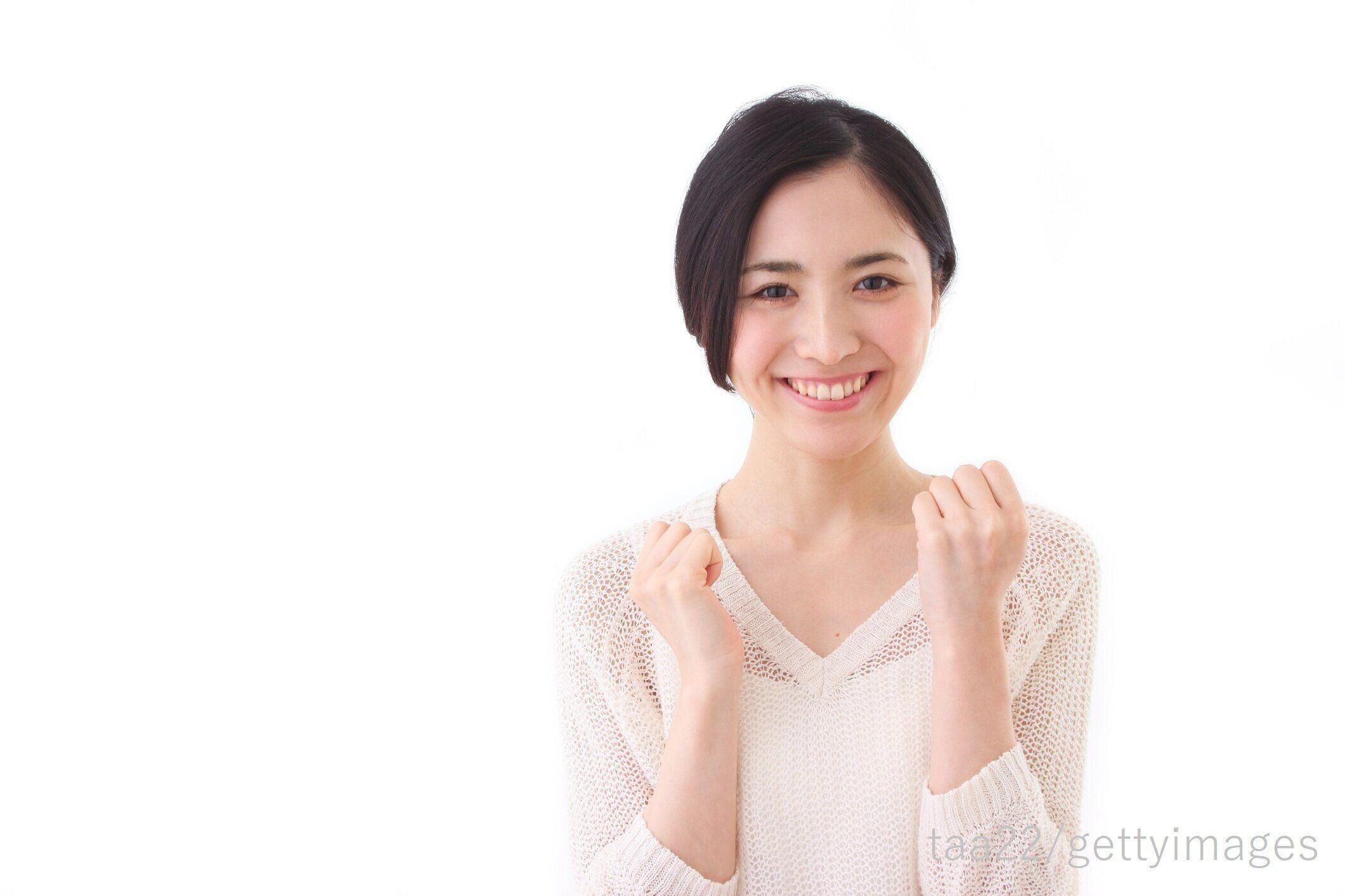 ガッツポーズした女性